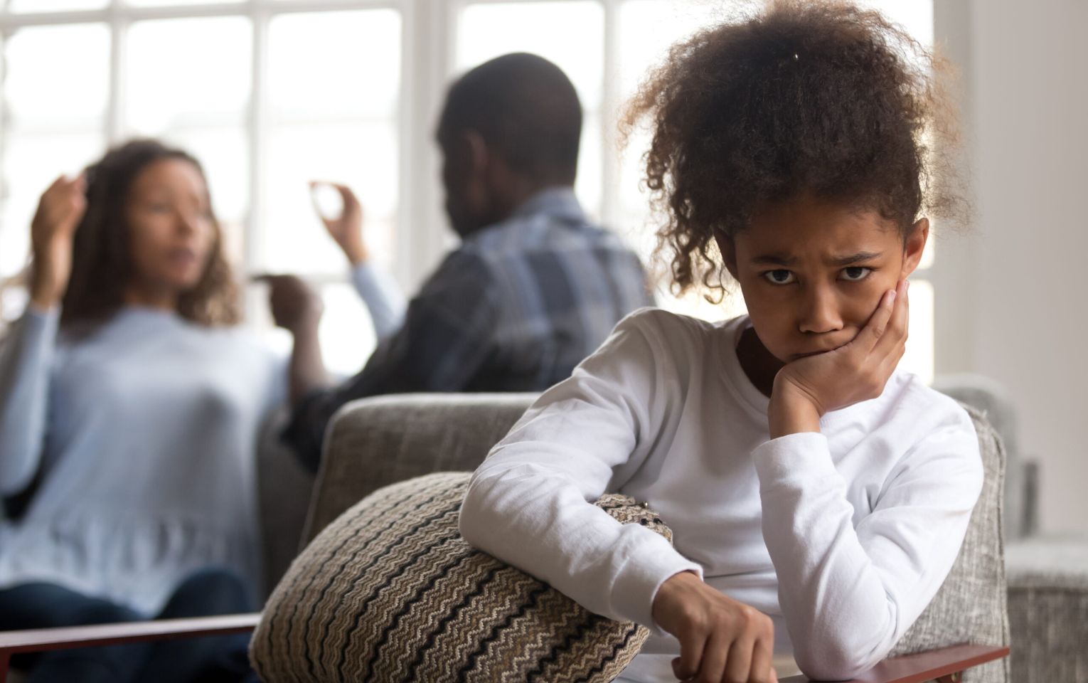 Upset kid daughter sad parents fighting | parenting coordination | Feinman & Childs Family Law